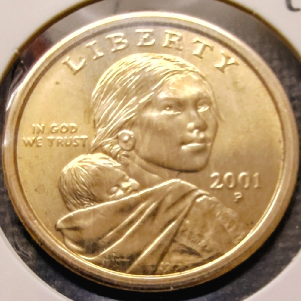 2001-P Sacagawea Gold-Toned $1.00 Coin In Very Good Circulated Condition.